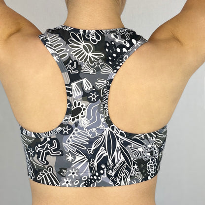 colourful sports bra made sustainably from recycled materials - black and white coral back