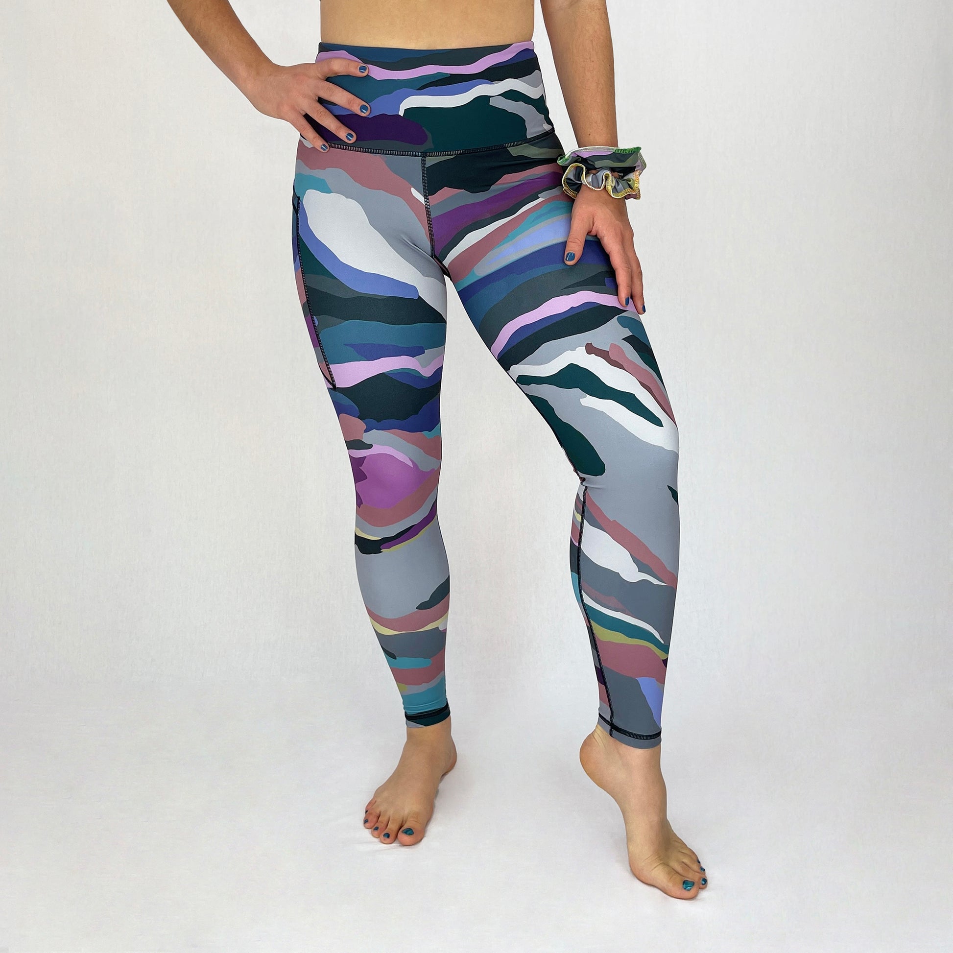 colourful high rise leggings with pockets made sustainably from recycled materials - purple camouflage front