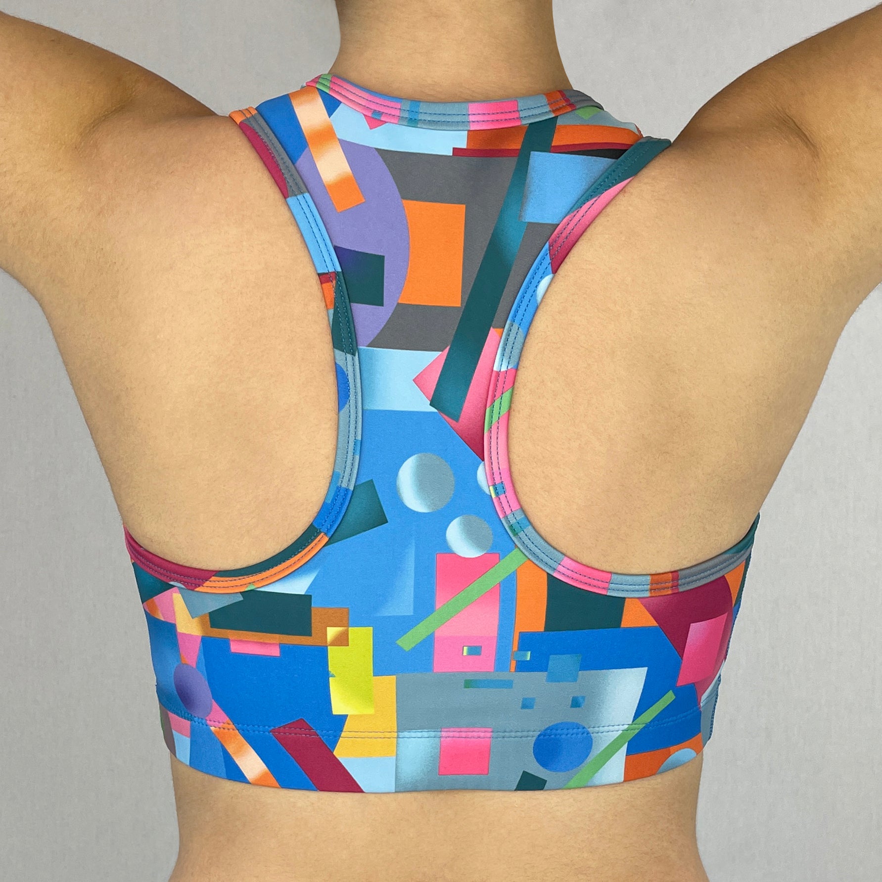 colourful sports bra made sustainably from recycled materials - Geometric - back
