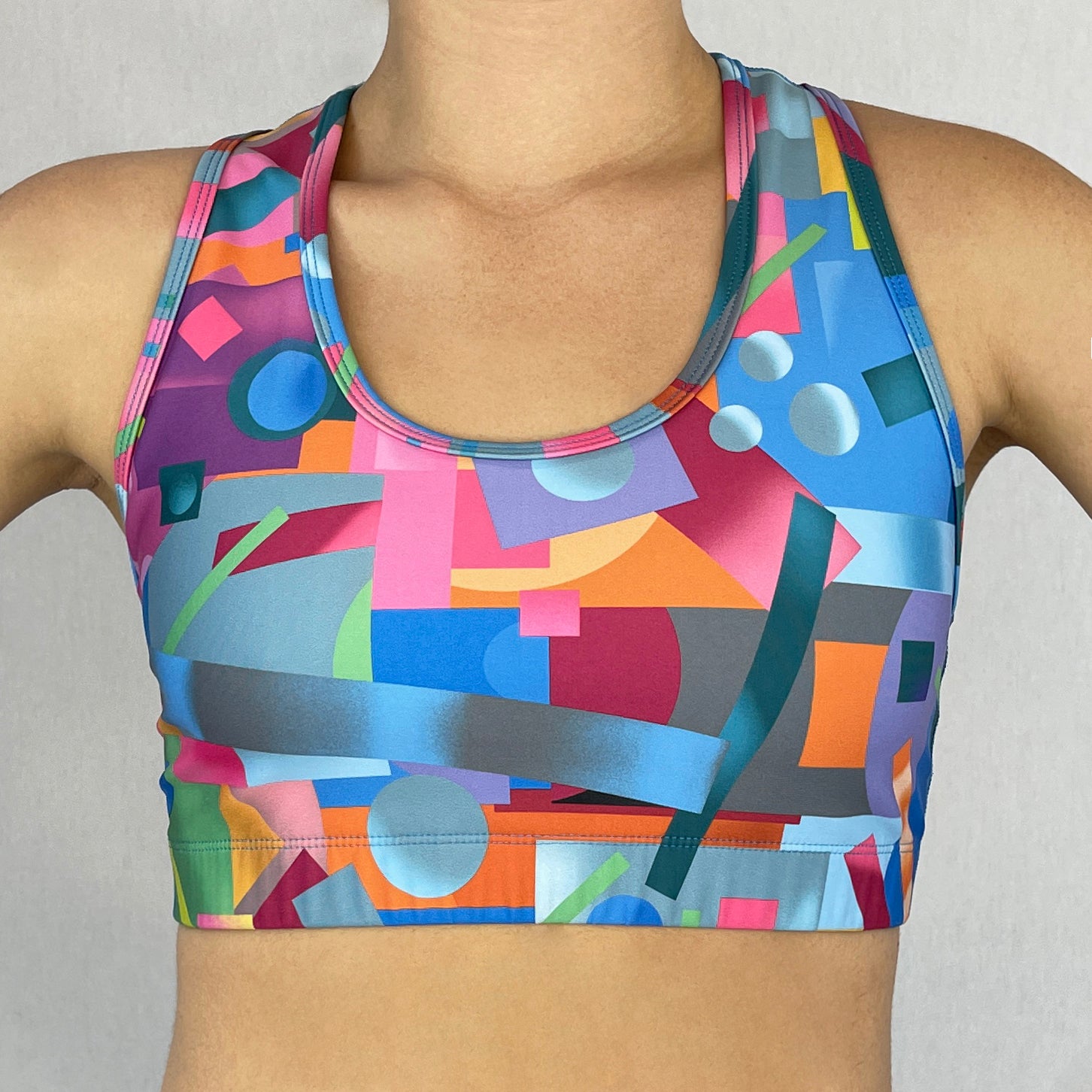 colourful sports bra made sustainably from recycled materials - Geometric - front