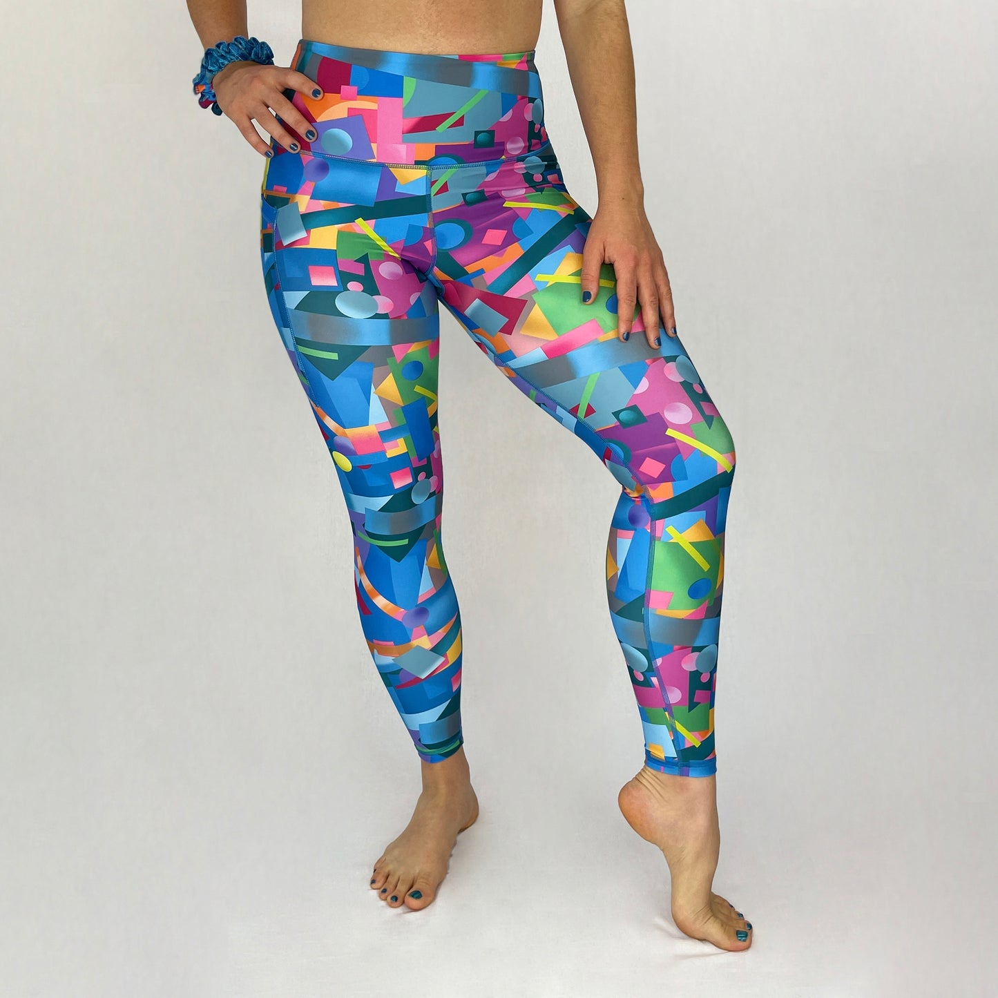 colourful high rise leggings with pockets made sustainably from recycled materials - geometric - front