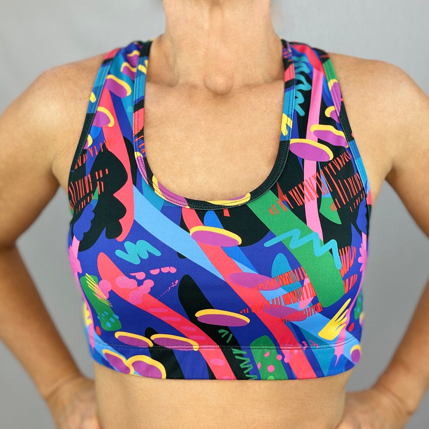 colourful sports bra made sustainably from recycled materials - Olympia - front