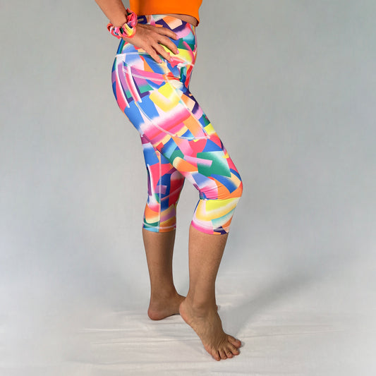 Side view of colourful 3/4-length leggings with pocket in Festive design by Art2Go Monique Baques