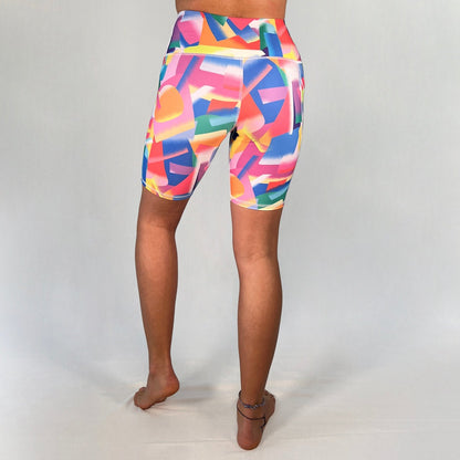 Back view of colourful bike shorts with pocket in Festive design by Art2Go Monique Baques