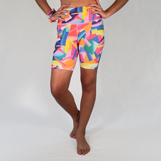 Front view of colourful bike shorts with pocket in Festive design by Art2Go Monique Baques