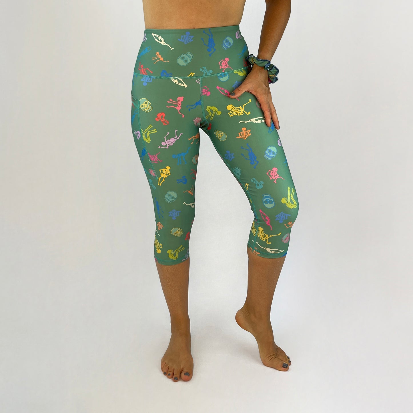 colourful high rise leggings with pockets made sustainably from recycled materials - skeletons and skulls front