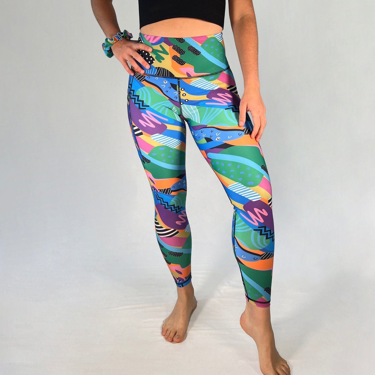 Front view of full-length leggings with pocket in Spark design by Art2Go Monique Baques