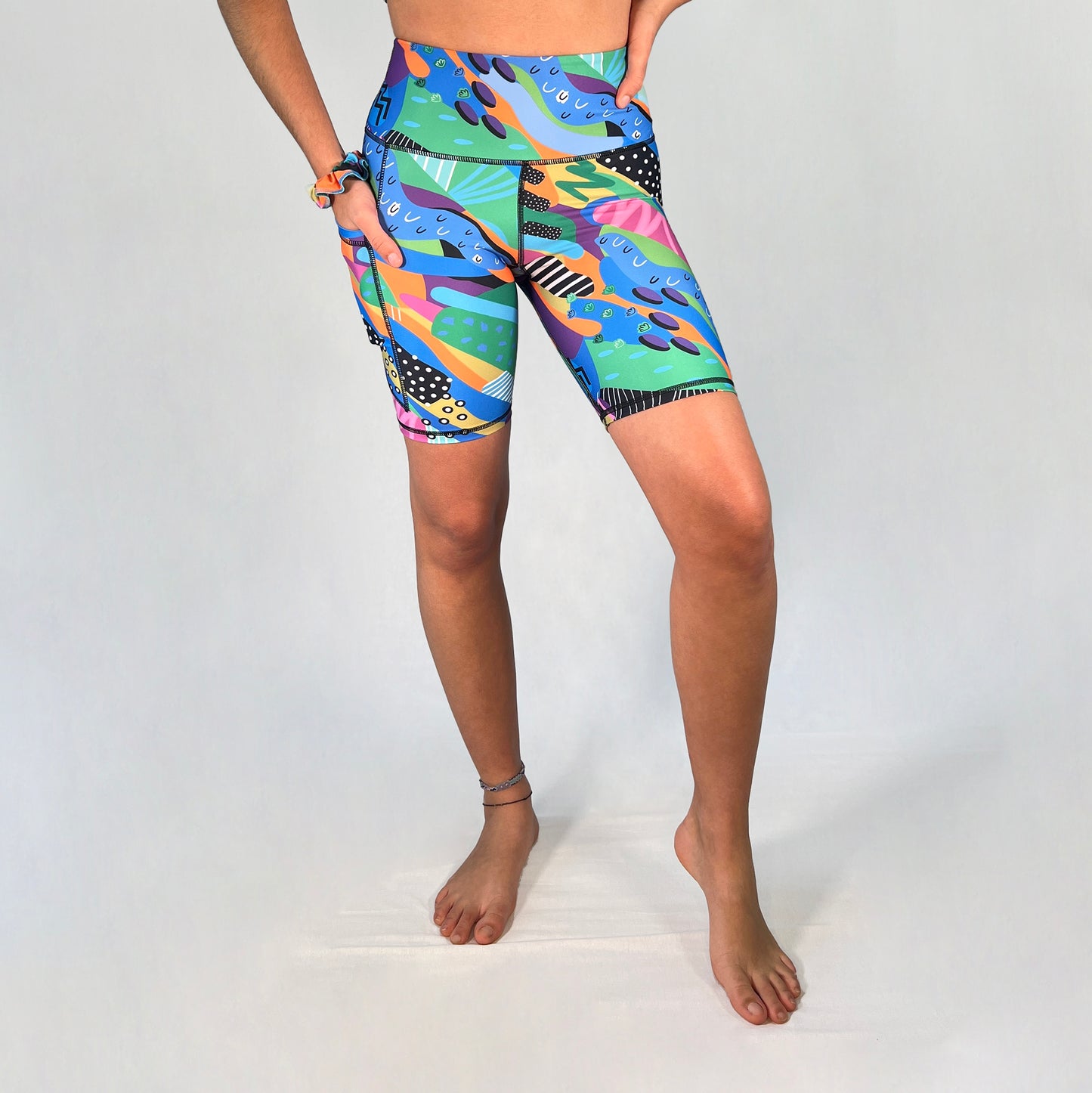 Front view of bike shorts with pocket in Spark design by Art2Go Monique Baques